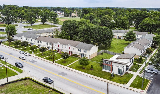 aerial view of building with green grass 
